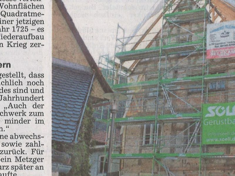 Zeitungsausschnitt mit Bild und Text