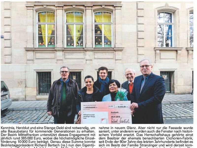 Zeitungsausschnitt mit Bild und Text