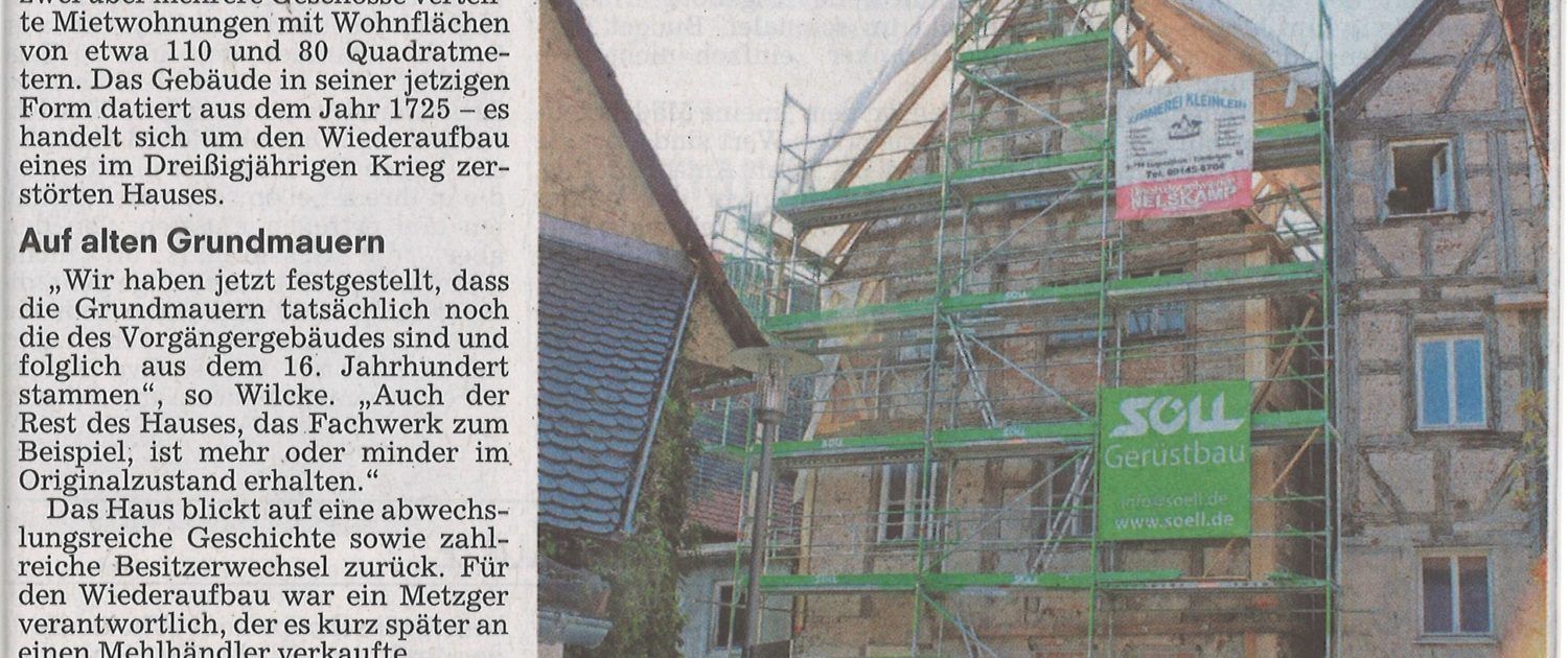 Zeitungsausschnitt mit Bild und Text